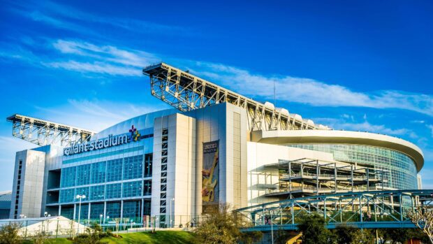 A clear view of Reliant Stadium in Houston Texas under a bright blue sky