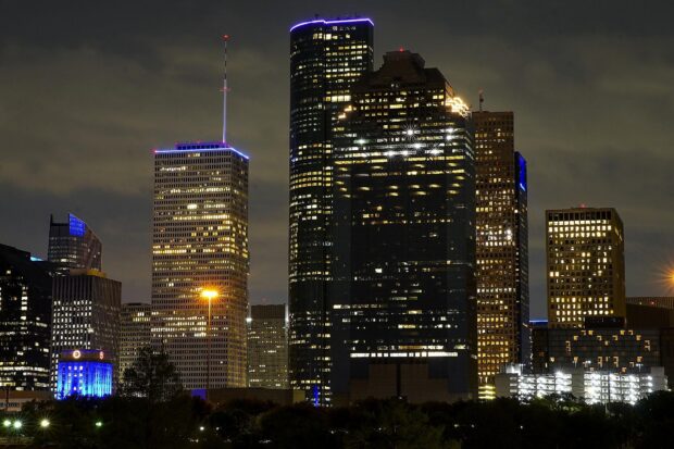 Night view of Houston cityscape with illuminated buildings and skyscrapers in Texas
