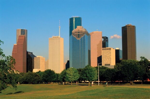 Houston city skyline with green park and clear blue sky in Texas