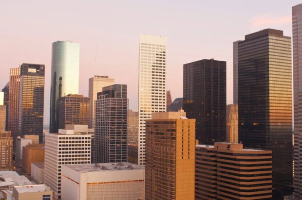 Houston cityscape with tall buildings and sunset light in Texas