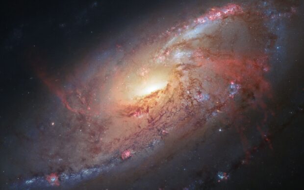 Spiral galaxy captured by Hubble showing star formation and cosmic dust