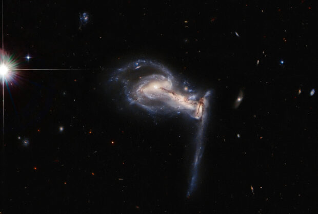 A stunning view of galaxy interaction captured by Hubble