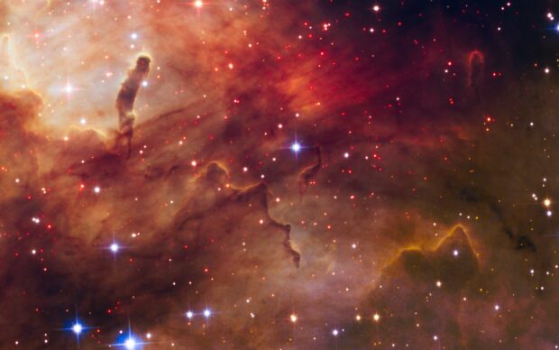Dark interstellar clouds and bright stars captured by Hubble in deep space