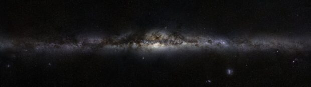 A panoramic view of the Milky Way galaxy captured by Hubble with numerous stars and cosmic dust visible