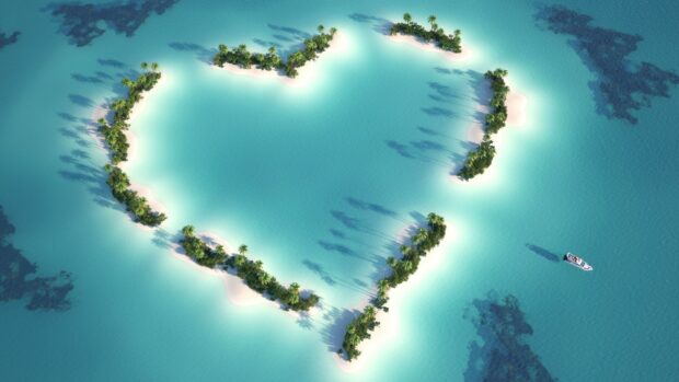 Heart shaped island greenery surrounded by turquoise waters in Indian Ocean