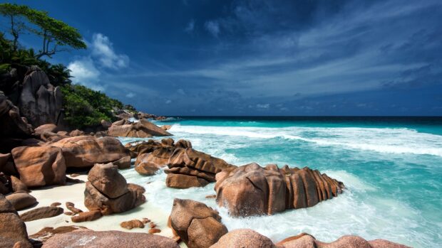 Rocky coastline of Indian Ocean with turquoise water and lush greenery