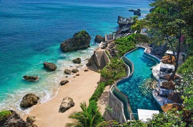 Tropical beach with turquoise water and rock formations in Indonesia serene Indonesian coast