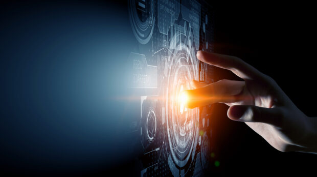 A hand interacting with futuristic technology interface showcasing innovation concepts