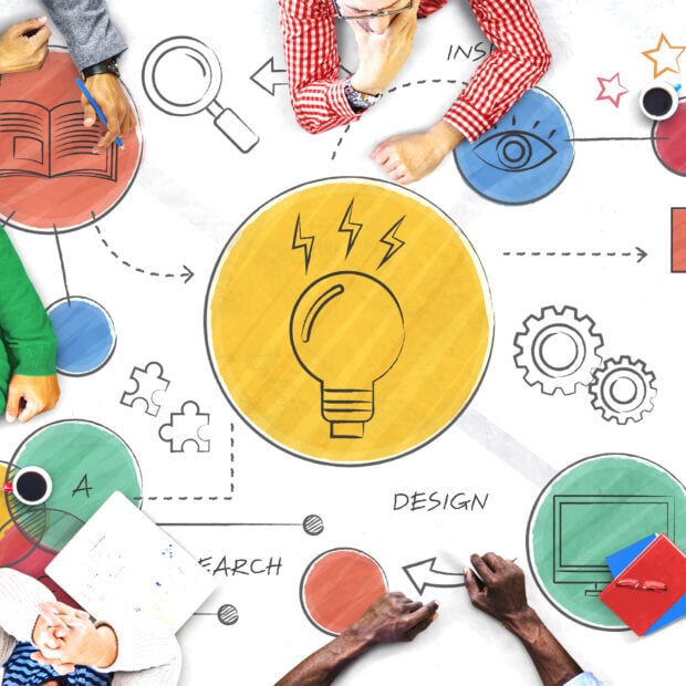 Creative teamwork brainstorming and design process with innovation concepts and ideas