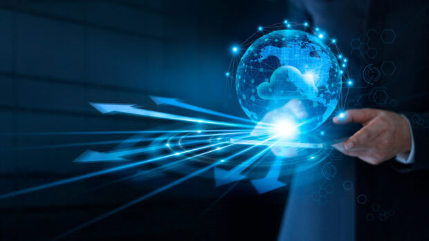 A digital concept of innovation with a glowing globe and cloud network in a business hand