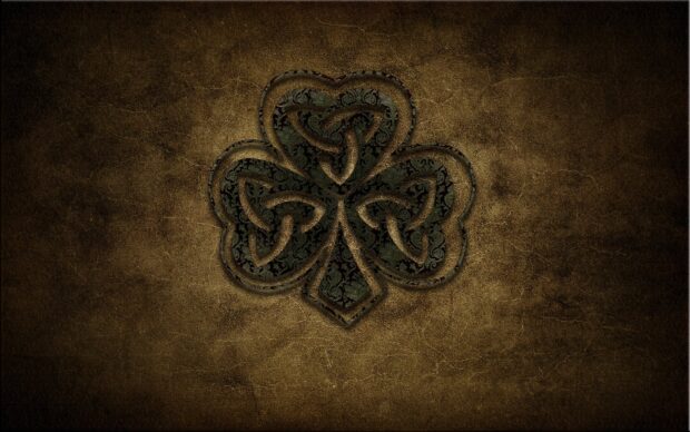 A detailed Irish shamrock with intricate patterns on a textured brown background