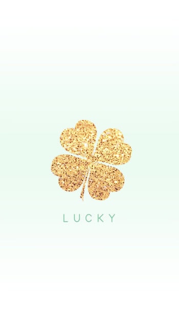 A golden shamrock with four heart shaped leaves symbolizing luck