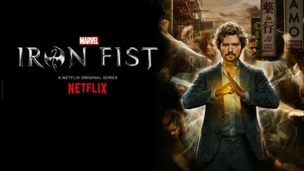 A man with iron fist powers preparing for a fight in an urban setting with Iron Fist logo