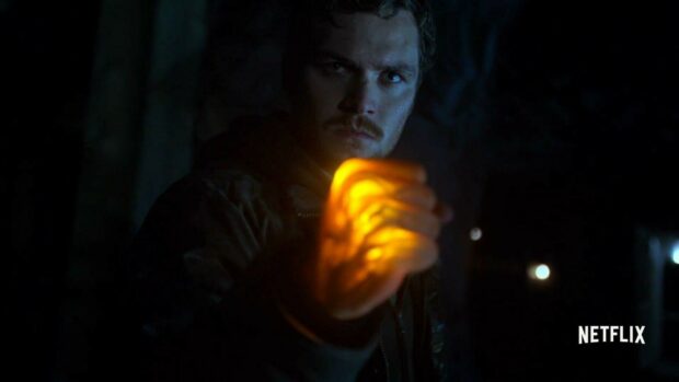 A man with glowing fist ready for battle in Iron Fist