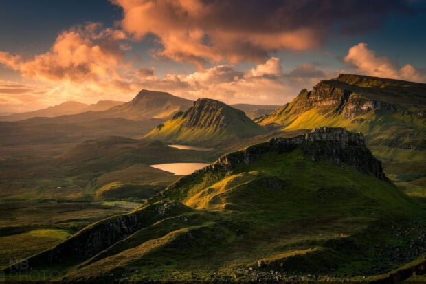 Stunning Isle of Skye mountain landscape bathed in golden sunlight during sunset