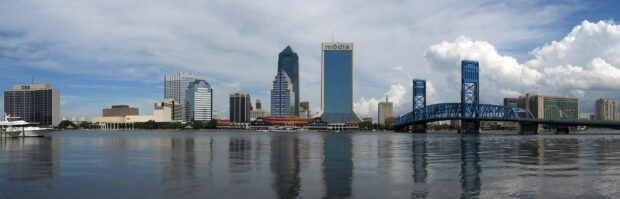 The Jacksonville skyline showing the cityscape across the waterfront with reflections on the river