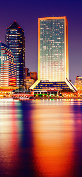Beautiful Jacksonville cityscape with vibrant lights reflecting on water at night