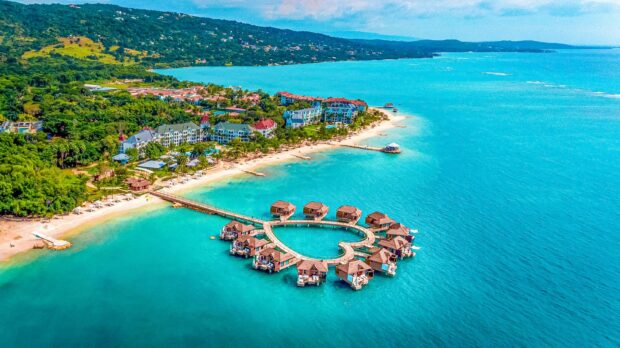 Scenic Jamaica coast with tropical resort and clear turquoise sea