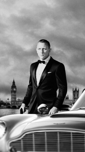 James Bond standing next to a classic car in a tuxedo near London landmarks