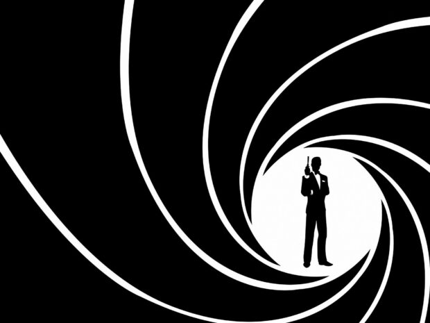 The silhouette of James Bond holding a gun with a spiral background design