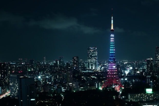 Japan skyline featuring Tokyo Tower illuminated with colorful lights at night
