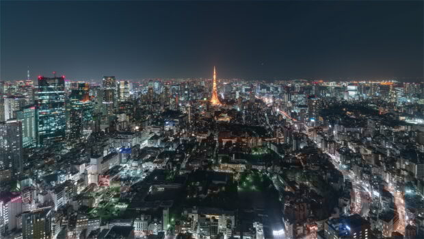 Night view of Japan skyline with illuminated Tokyo Tower and city lights in 4K quality