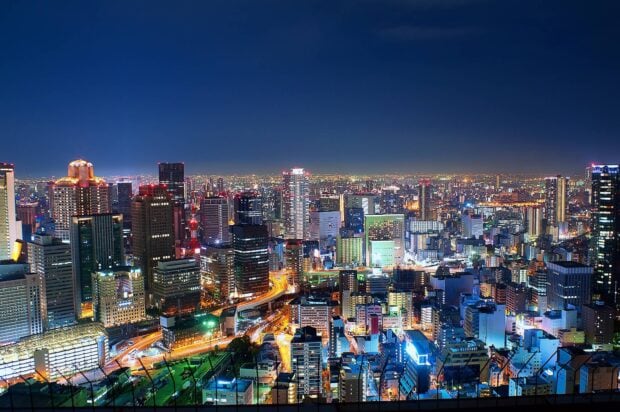 Beautiful Japan skyline lit up at night with numerous buildings and streets visible