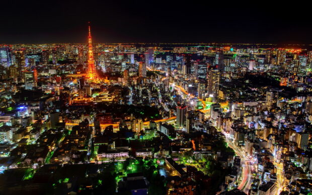 Night view of Japan skyline with Tokyo Tower glowing brightly in the cityscape