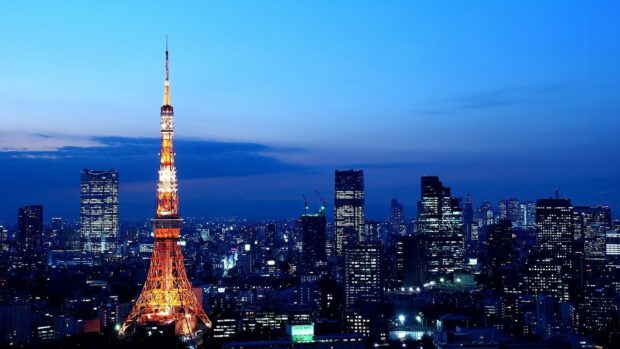 Tokyo Tower is a landmark in Japan skyline glowing brightly at night