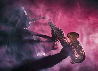 A jazz musician playing saxophone surrounded by purple smoke on stage