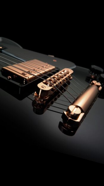 Close up view of jazz guitar strings and bridge in black and gold finish