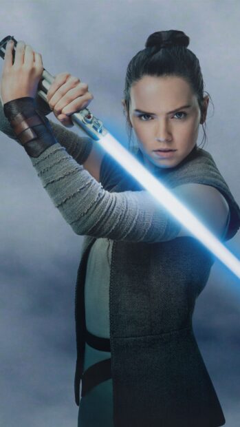 A determined jedi holding a glowing blue lightsaber ready for battle
