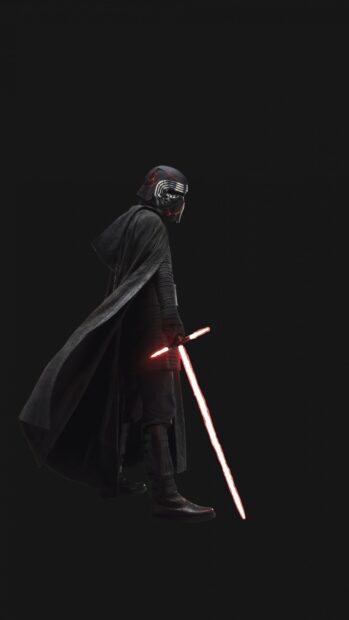 Dark armored Jedi holding a glowing red lightsaber against a black background