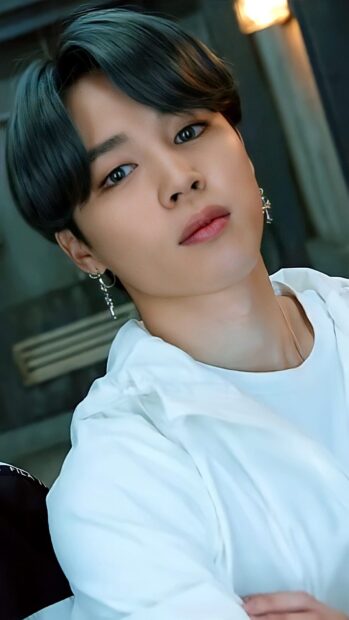 Close up portrait of Jimin with stylish earrings and dark hair