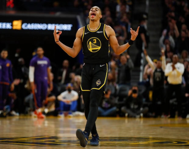 Jordan Poole celebrating on the basketball court during a game in Golden State Warriors uniform (1)