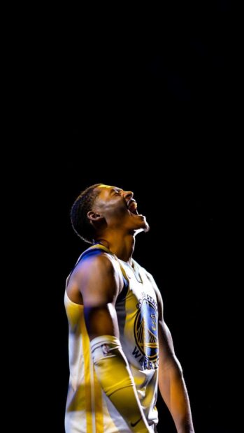 Jordan Poole celebrating passionately in Golden State Warriors uniform