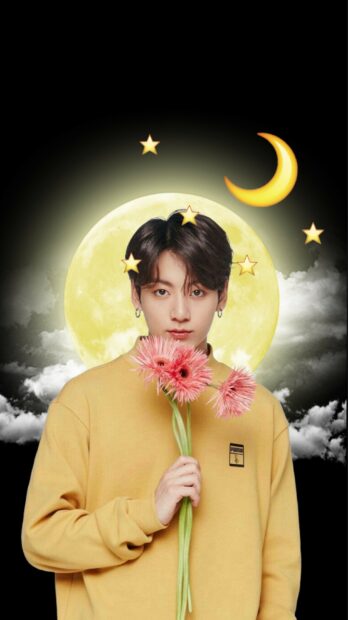 Jungkook holding pink flowers with a moon and stars background in a yellow sweater