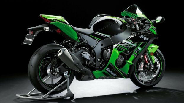 Green Kawasaki sport motorcycle showcased on a black background with detailed side view