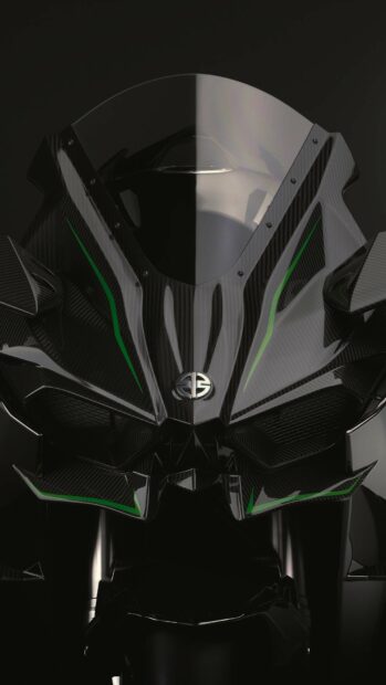Close up of Kawasaki motorcycle front with carbon fiber design and green accents