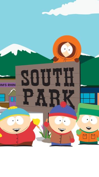Kenny wearing an orange hoodie with friends in front of the South Park sign