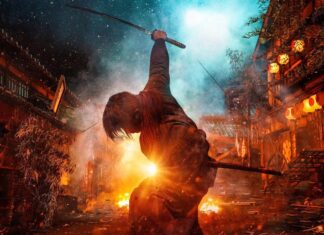 Kenshin warrior raising sword amidst fiery battle in a traditional Japanese village