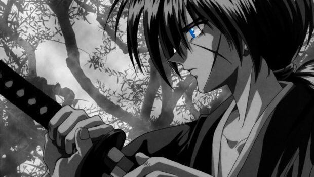 Kenshin holding his sword with a focused expression in a misty forest setting