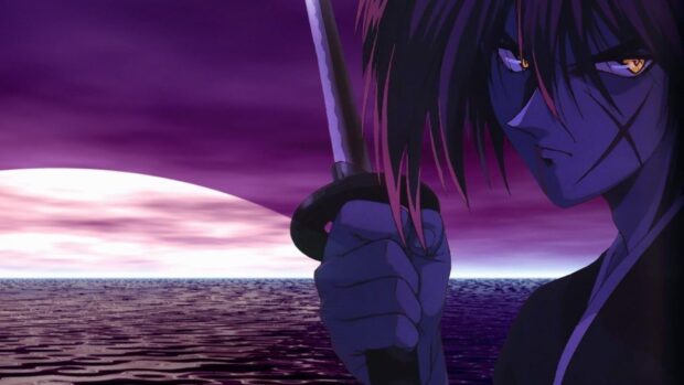 Kenshin holding a sword with a serious expression by the ocean at sunset