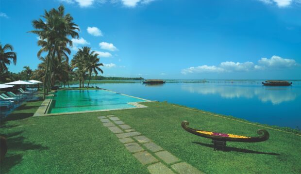 Serene Kerala landscape with palm trees and water views in vibrant nature