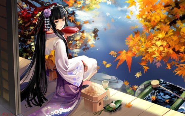 A woman wearing a kimono enjoying tea outdoors near autumn leaves and a calm pond