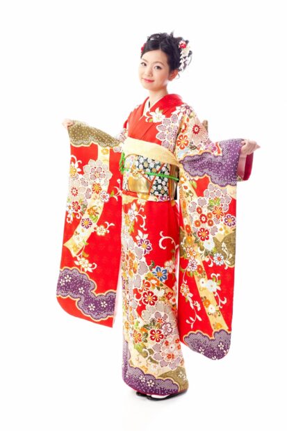 Young woman wearing a colorful traditional kimono with floral patterns