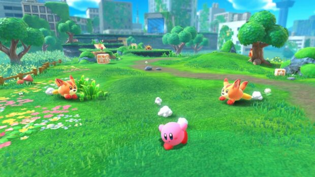 Kirby character running through green fields with enemies in a vibrant forgotten land