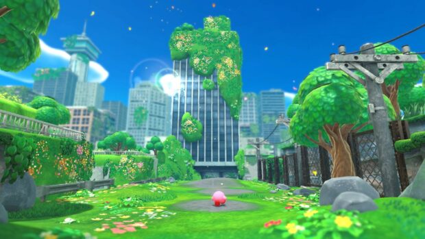 Kirby exploring the forgotten land with lush greenery and abandoned buildings in the background