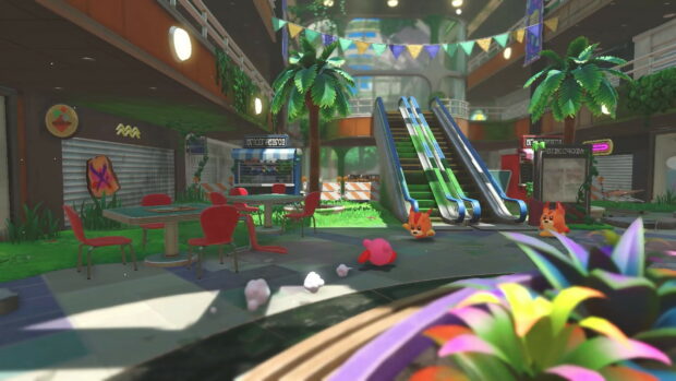 Kirby And The Forgotten Land featuring Kirby running from enemies in a colorful abandoned mall environment