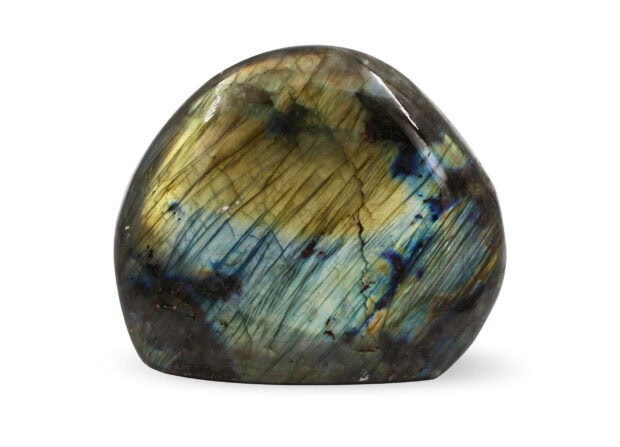 Polished labradorite stone showing iridescent colors and natural patterns on a white background